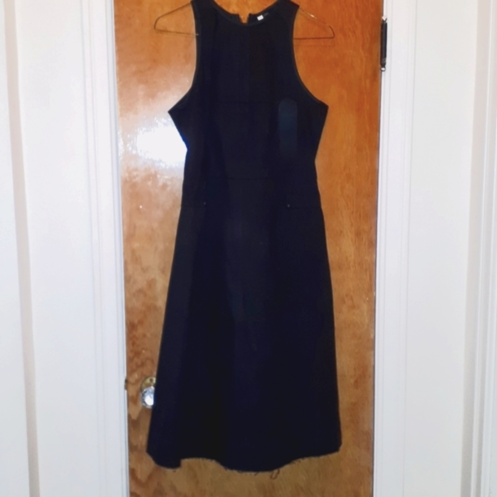 NWT SZ small denim. Pleated skirt. Black in color. Not a lot of give is this